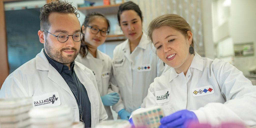 Dr. Nicole De Nisco conducts research aimed at understanding the basis for recurring urinary tract infections in postmenopausal women. In her lab, students monitor the growth of various bacteria on cell-culture dishes.