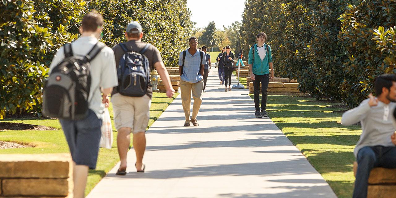 UTD students walking on campus, where the Living Our Values Task Force was created in 2020 to examine issues related to racial equity, inclusion and diversity.